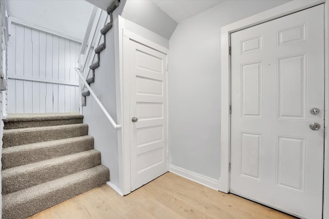 stairway featuring light hardwood / wood-style flooring