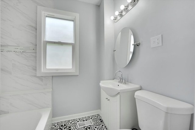 bathroom with tile patterned floors, vanity, and toilet