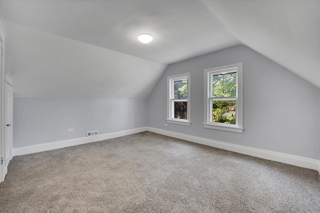 bonus room featuring carpet and lofted ceiling