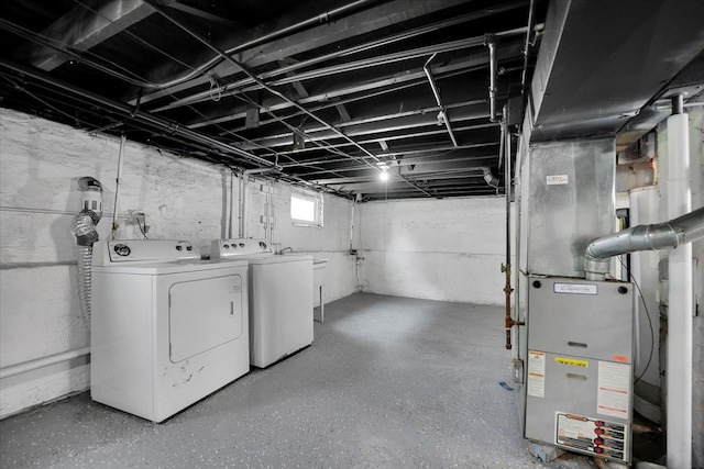 basement with washing machine and clothes dryer