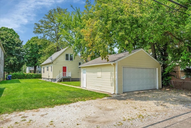 garage featuring a yard