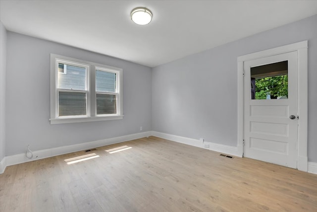 empty room with light wood-type flooring