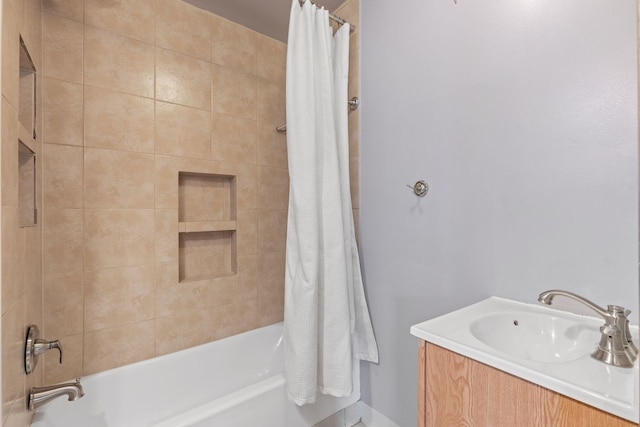 bathroom with vanity and shower / bathtub combination with curtain