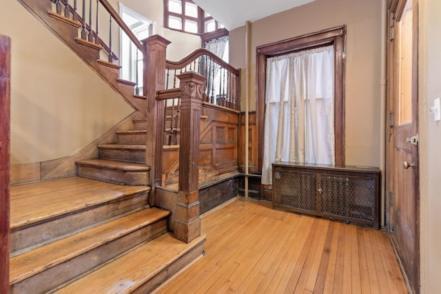 staircase featuring wood-type flooring