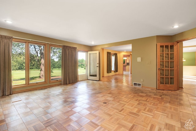 spare room with french doors and light parquet flooring