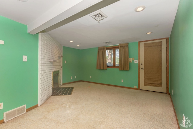 unfurnished living room featuring a fireplace, light carpet, and beam ceiling