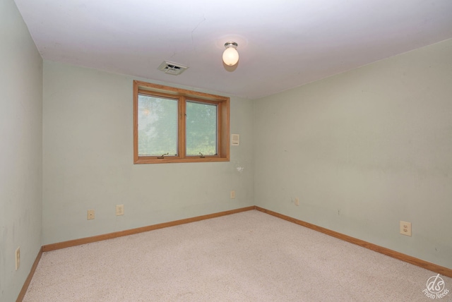 empty room featuring light colored carpet