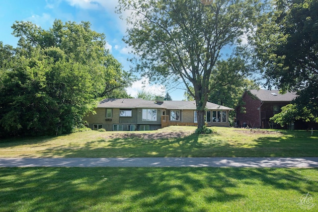 ranch-style home featuring a front yard