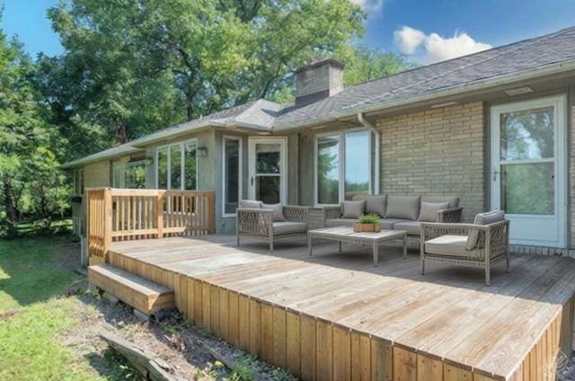 wooden deck with an outdoor hangout area