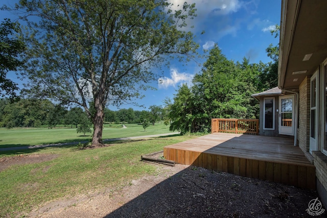 view of yard with a wooden deck