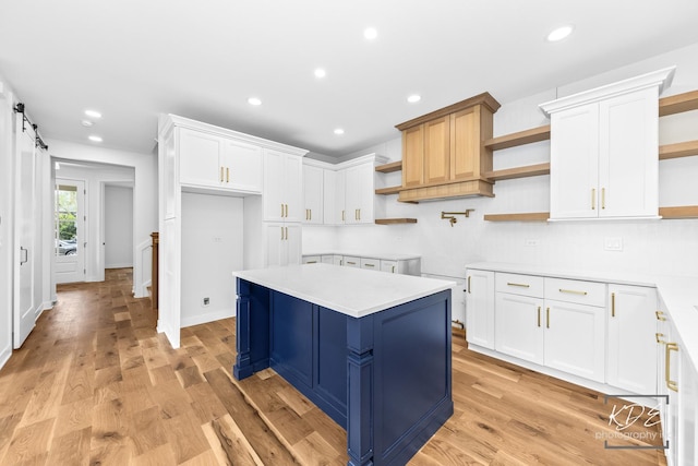kitchen featuring recessed lighting, open shelves, and white cabinetry