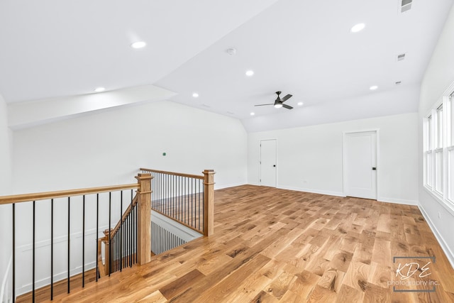additional living space featuring recessed lighting, a ceiling fan, vaulted ceiling, and light wood finished floors
