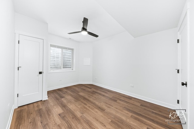 unfurnished bedroom featuring baseboards, a ceiling fan, and wood finished floors
