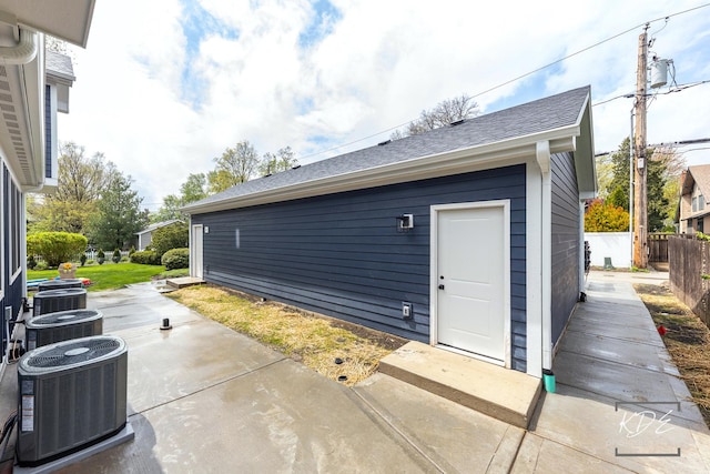 exterior space with central air condition unit and fence