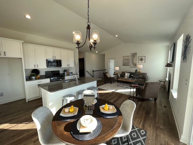 kitchen with white cabinetry, range with gas cooktop, and dark hardwood / wood-style flooring