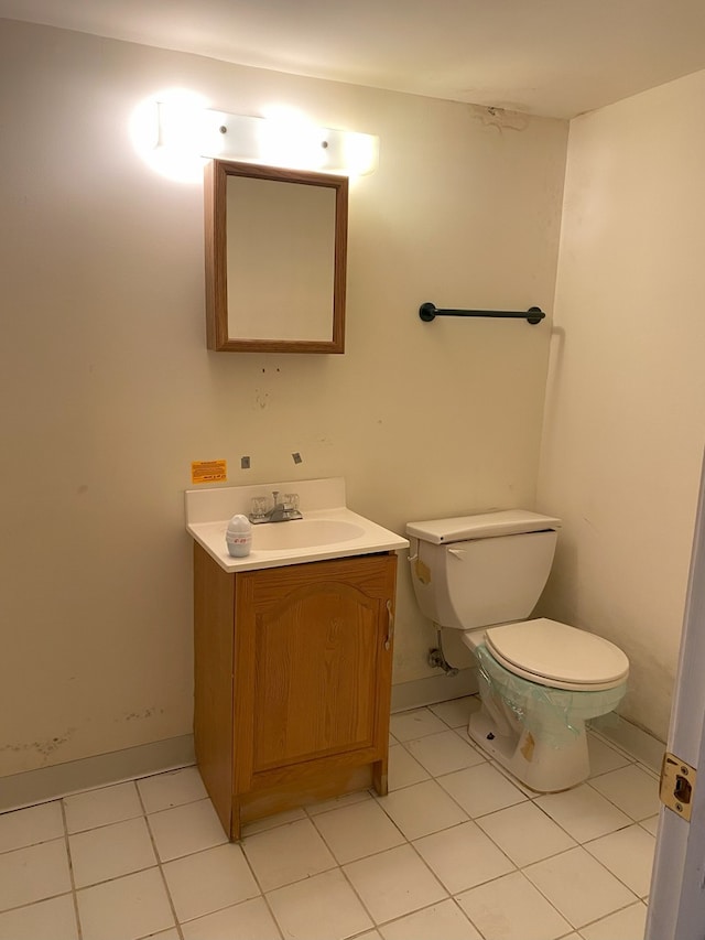 8315 S Dante Ave, Chicago, IL 60619 - bathroom with tile patterned flooring, vanity, baseboards, and toilet