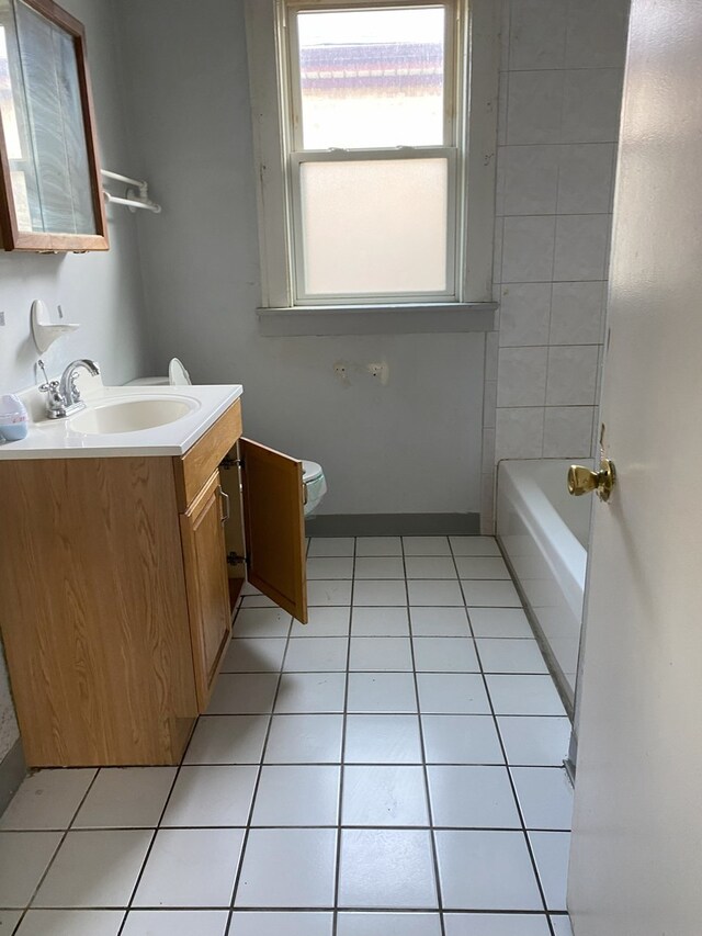 8315 S Dante Ave, Chicago, IL 60619 - full bath featuring a tub to relax in, toilet, tile patterned flooring, and vanity