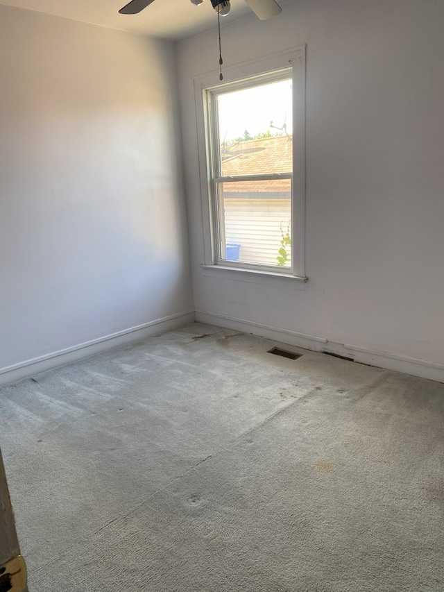 8315 S Dante Ave, Chicago, IL 60619 - carpeted empty room featuring visible vents, baseboards, and a ceiling fan