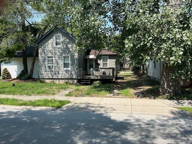 view of front of property with a wooden deck