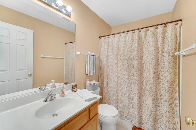 bathroom with vanity and toilet