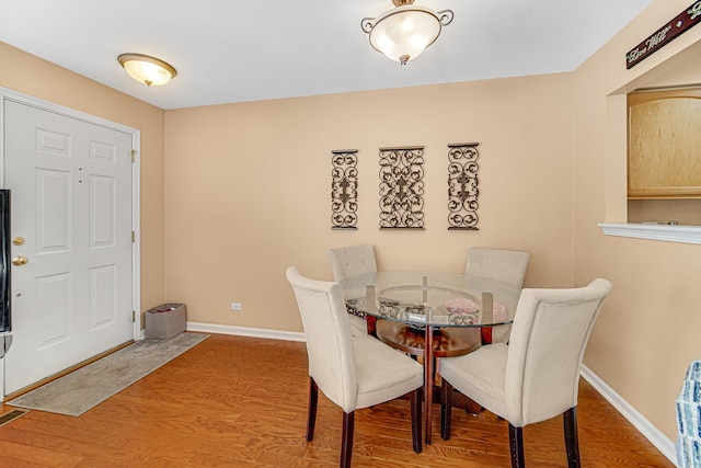 dining space featuring hardwood / wood-style flooring