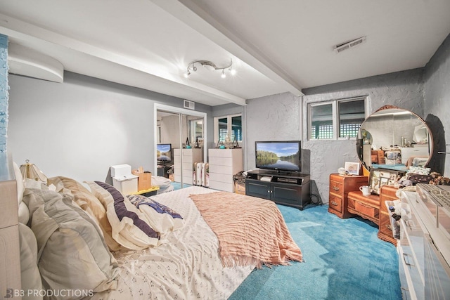 bedroom with light carpet, a textured wall, beamed ceiling, and visible vents