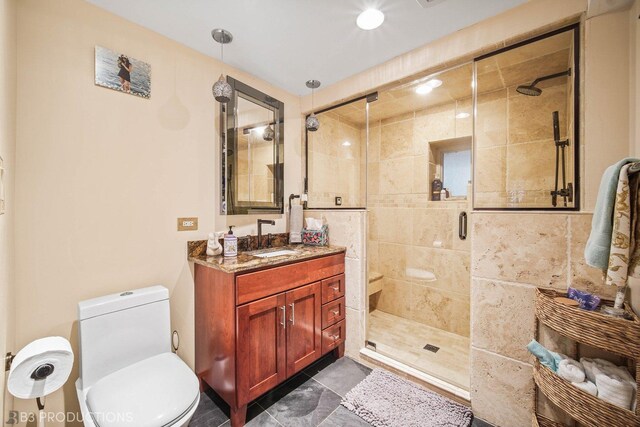 bathroom featuring tile patterned flooring, an enclosed shower, toilet, and vanity