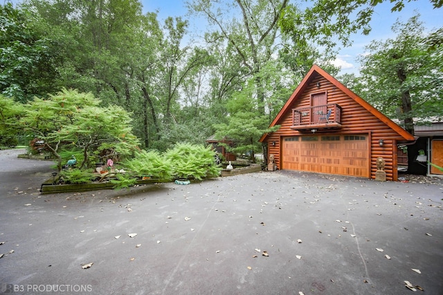 view of side of property featuring an outdoor structure and a garage