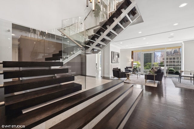 stairs featuring hardwood / wood-style flooring