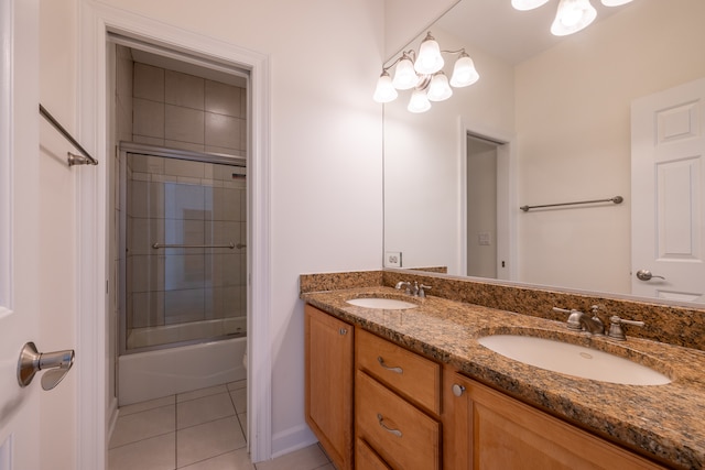 bathroom featuring tile patterned floors, enclosed tub / shower combo, and vanity