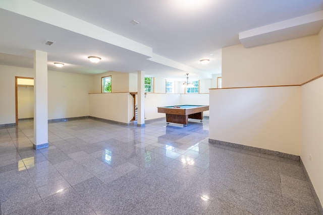 interior space with granite finish floor, visible vents, and baseboards