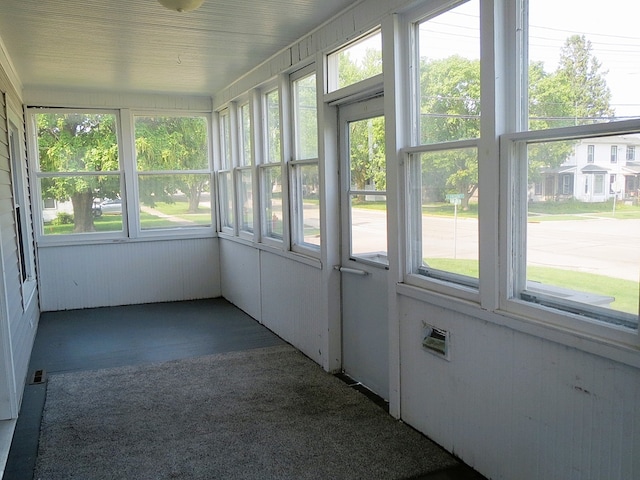 unfurnished sunroom with a healthy amount of sunlight