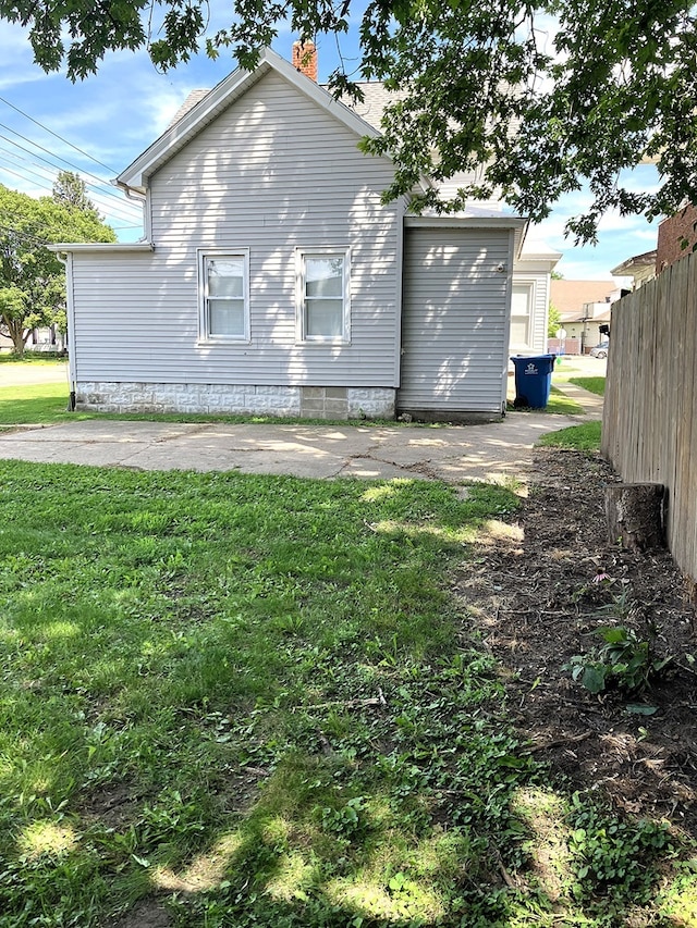 view of home's exterior featuring a lawn