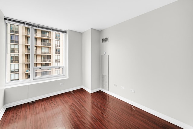 empty room with wood-type flooring