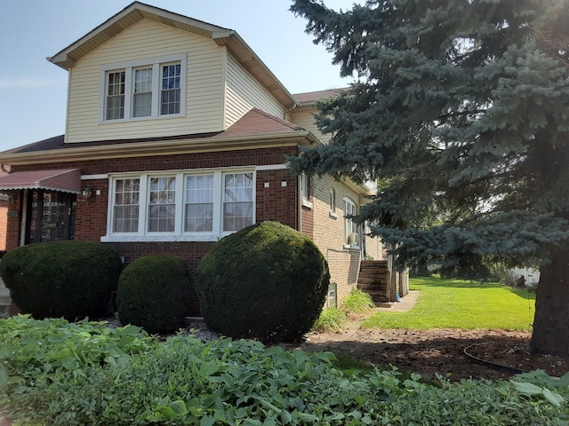 view of home's exterior featuring a yard