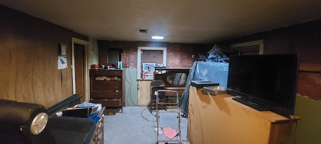 interior space with brick wall and concrete floors