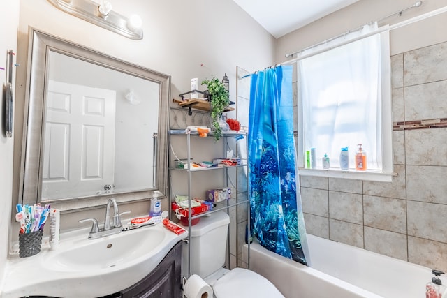 full bathroom featuring vanity, toilet, and shower / bath combination with curtain