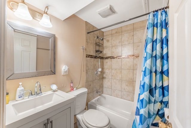 full bathroom featuring shower / bathtub combination with curtain, toilet, and vanity