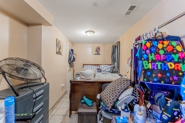 bedroom with light tile patterned floors