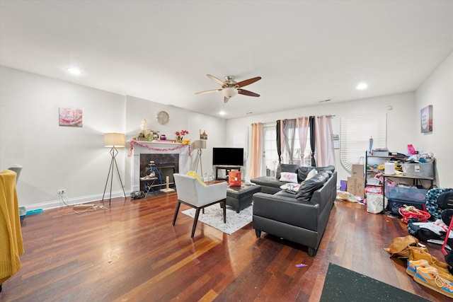 living room featuring ceiling fan, hardwood / wood-style flooring, and a high end fireplace