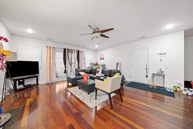 living room with hardwood / wood-style flooring and ceiling fan