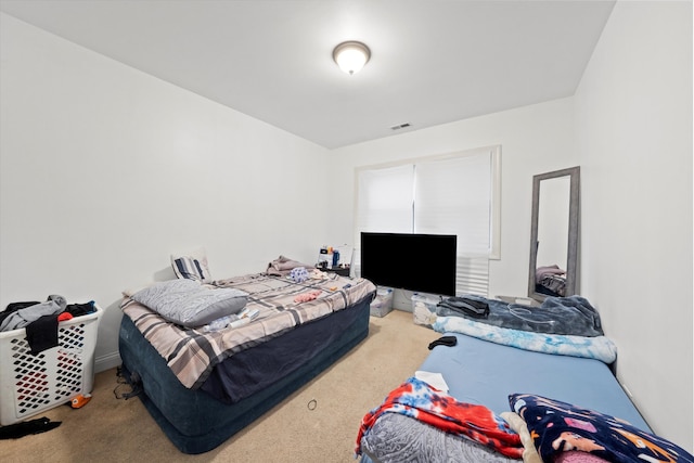 bedroom featuring carpet