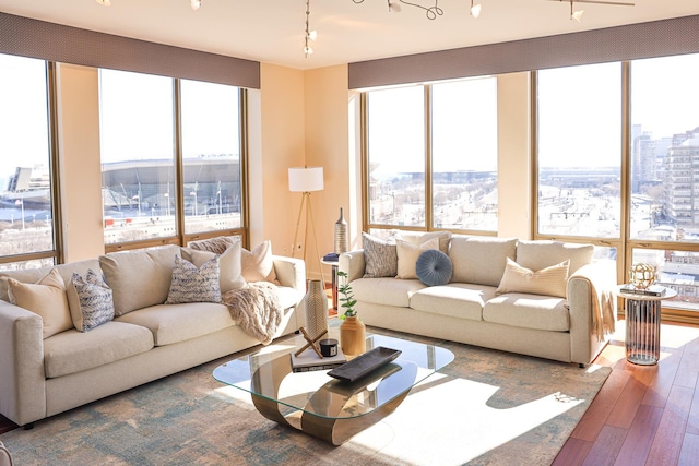 living area featuring a view of city and hardwood / wood-style floors