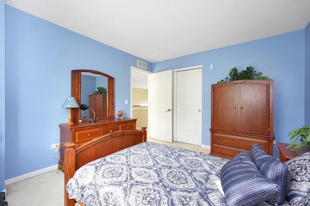 bedroom with light colored carpet