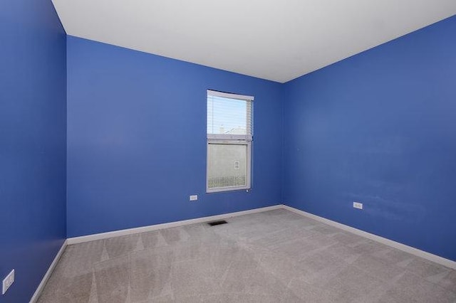 empty room featuring carpet flooring