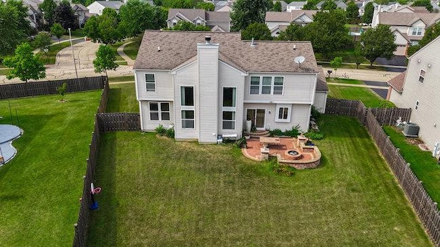 rear view of house with a patio area and central air condition unit