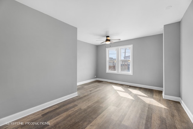 empty room with ceiling fan and wood-type flooring