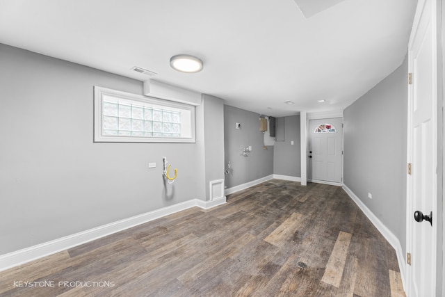 basement featuring hardwood / wood-style floors