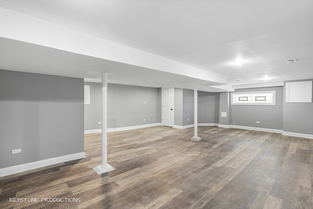 basement with hardwood / wood-style flooring