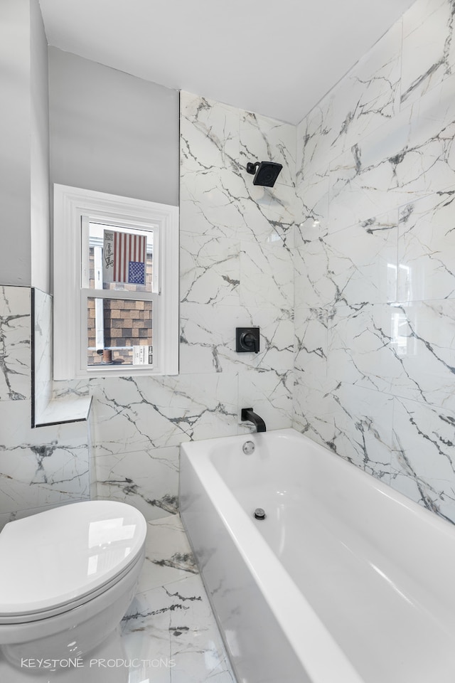 bathroom with tiled shower / bath, tile walls, and toilet